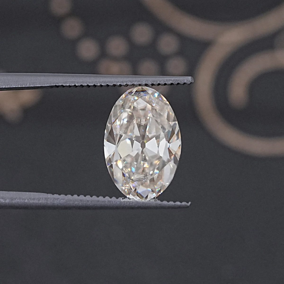 In Tweezer View Of Old Mine Oval Cut Loose Moissanite Stone