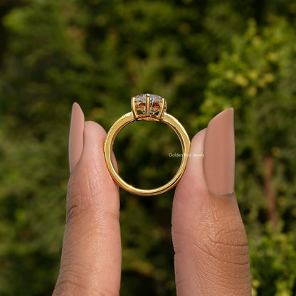 Gold-tone ring band with prong-set oval stone in reverse view