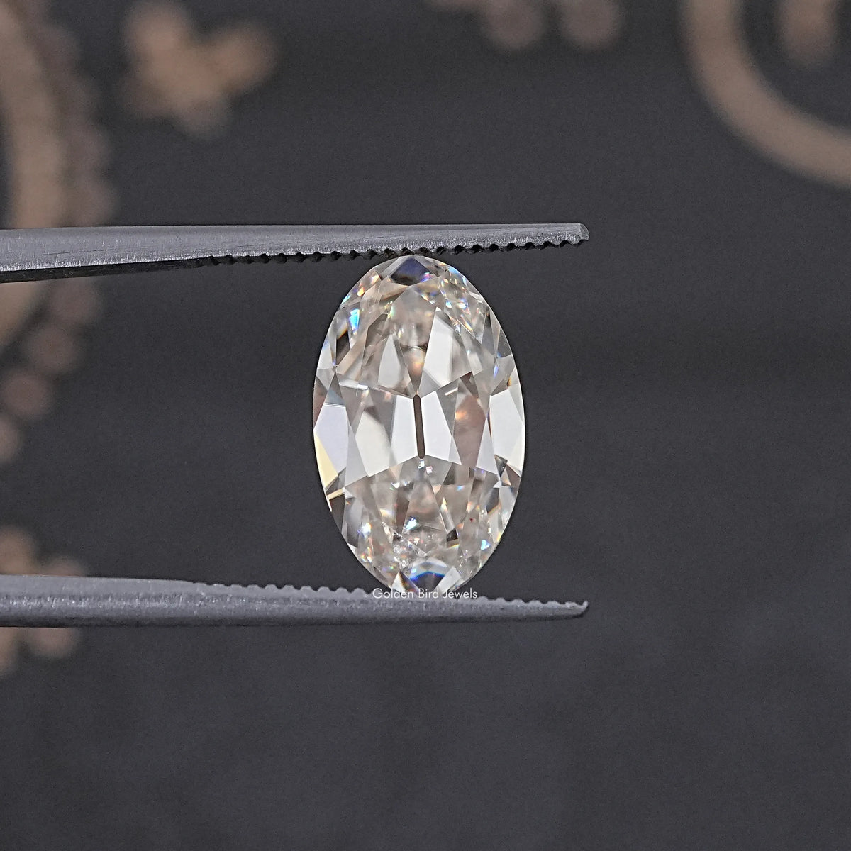 In Tweezer View Of Old Mine Oval Cut Loose Moissanite Stone