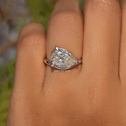 Sterling silver pear-cut moissanite solitaire ring with prong-set center stone
