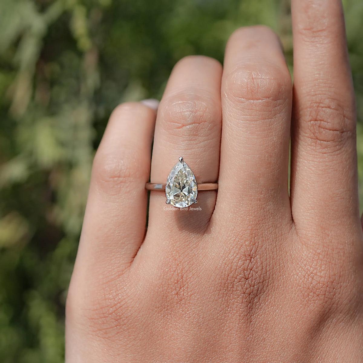 In finger front view of Halo Moissanite Engagement Ring  