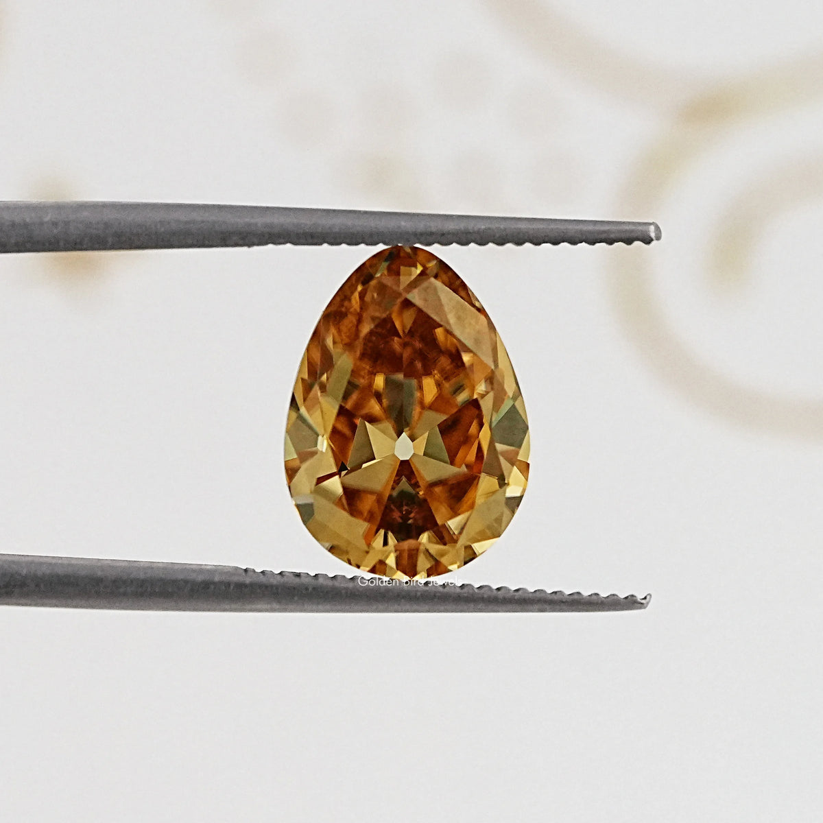 In Tweezer View Of Old Mine Pear Cut Loose Moissanite Stone