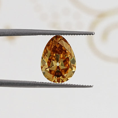 In Tweezer View Of Old Mine Pear Cut Loose Moissanite Stone