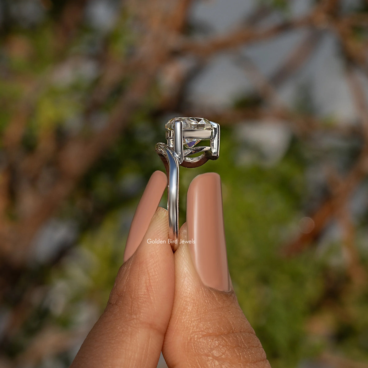 Pear-cut moissanite solitaire ring in sterling silver, side view of open gallery