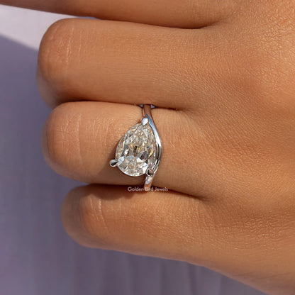 Pear-cut moissanite solitaire ring in sterling silver with claw-set center stone