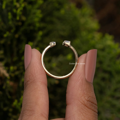 Gold open cuff ring with two raised bezel-set stones