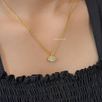 Gold-tone oval lab diamond solitaire pendant necklace at neckline