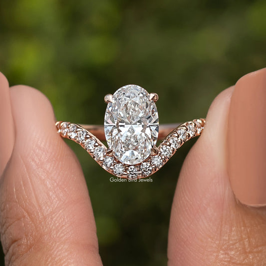 Oval-cut lab diamond ring with curved pavé accents in rose gold