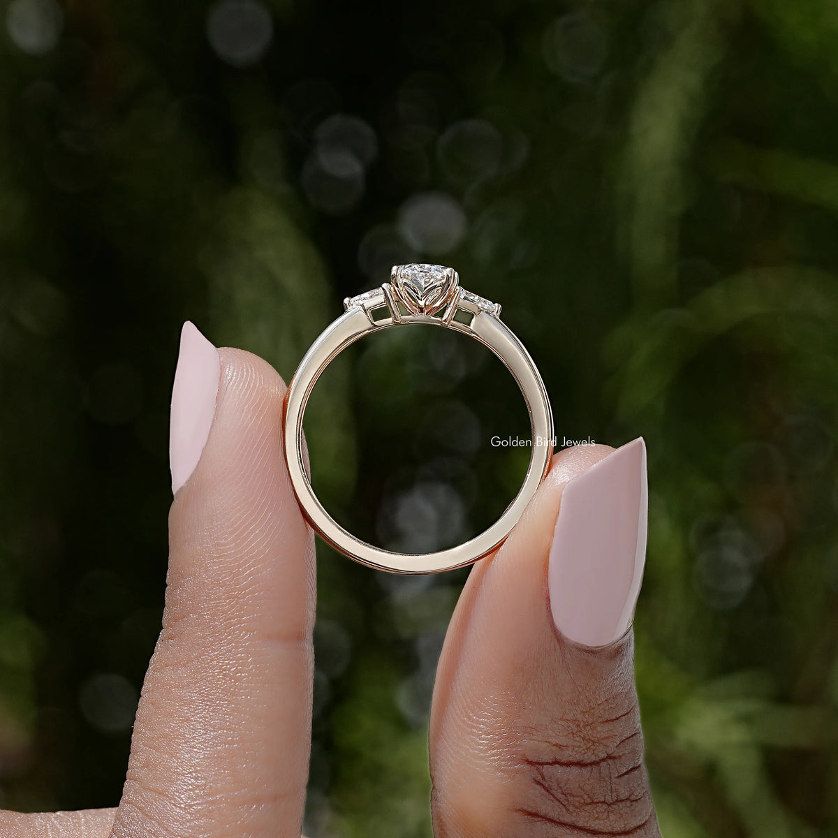 Three-stone lab-grown diamond ring, silver band with prong-set round center stone