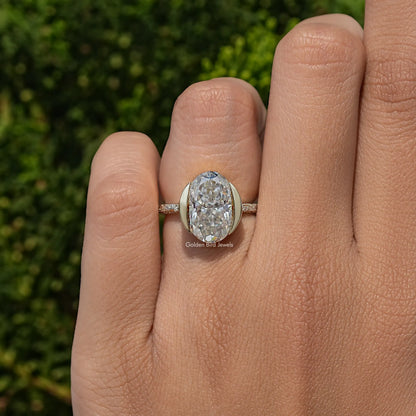 Oval-cut moissanite solitaire ring in 925 sterling silver on a hand