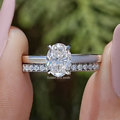 Oval cut moissanite bridal ring set with oval center stone and pavé band