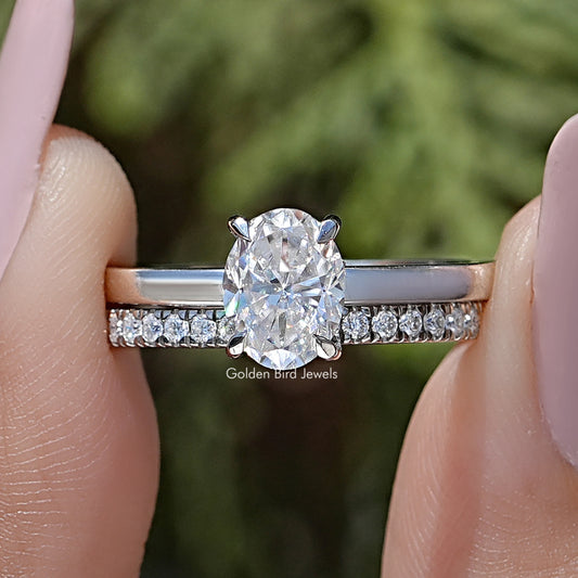 Oval cut moissanite bridal ring set with oval center stone and pavé band