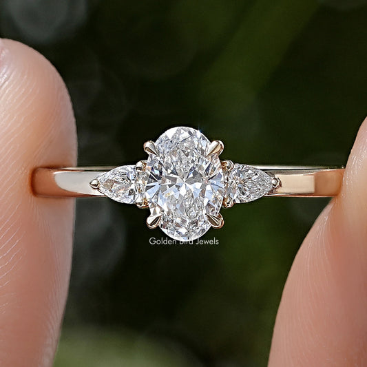 Three-stone lab-grown diamond anniversary ring, round center with side stones