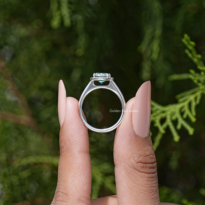 Sterling silver oval moissanite halo ring seen from the back with prongs