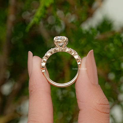 Moissanite bridal ring set with oval center stone and pavé band, side profile