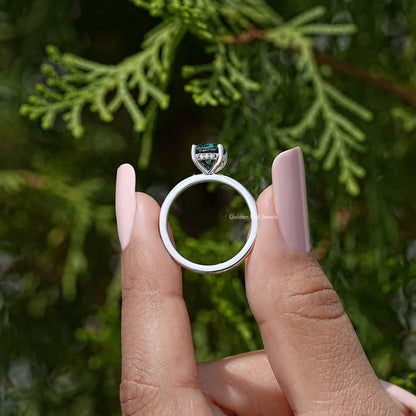 Sterling silver oval-cut teal moissanite ring with hidden halo band view