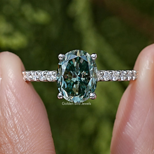 Oval teal moissanite solitaire ring in 925 silver, prong-set center with diamond band