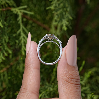 Sterling silver band with oval moissanite center and leaf-shaped side stones, front view