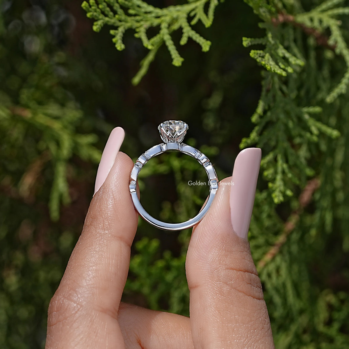 Rear view of sterling silver oval moissanite ring band with prong-set center stone