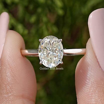 Oval moissanite solitaire engagement ring, prong-set oval stone on silver band
