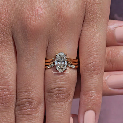 Oval lab diamond ring with rose-gold tone and sparkling side accents