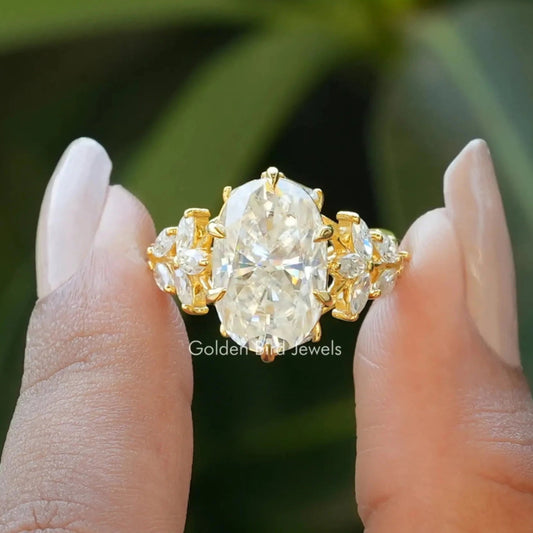 Front View of Oval And Marquise Cut Moissanite Ring In two Fingers