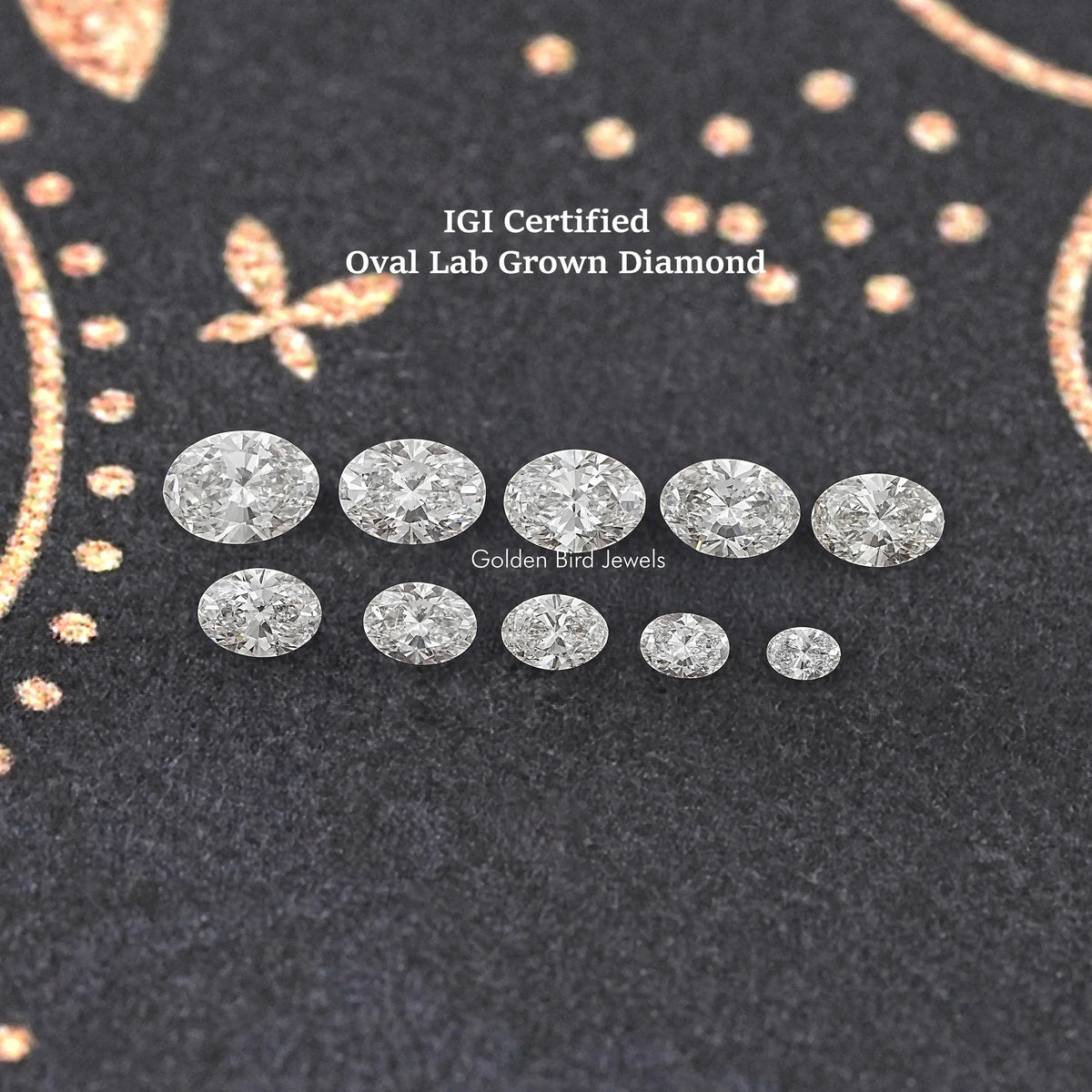 Oval-cut lab-grown diamond assortment in two rows on dark felt display