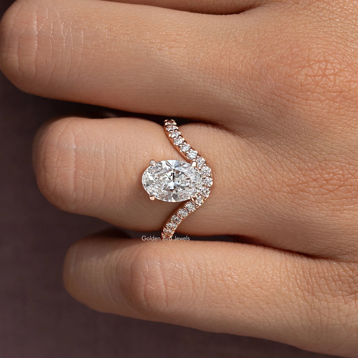 Oval cut lab diamond ring with curved pavé accent band