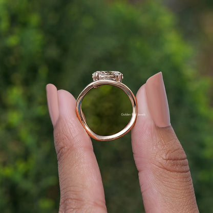 Rose-gold curved band ring with oval solitaire setting, back view