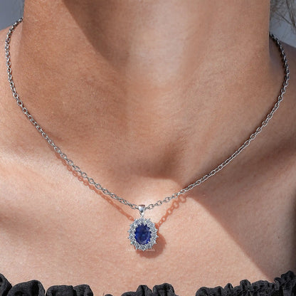 View of lab grown gemestone oval cut halo pendant 