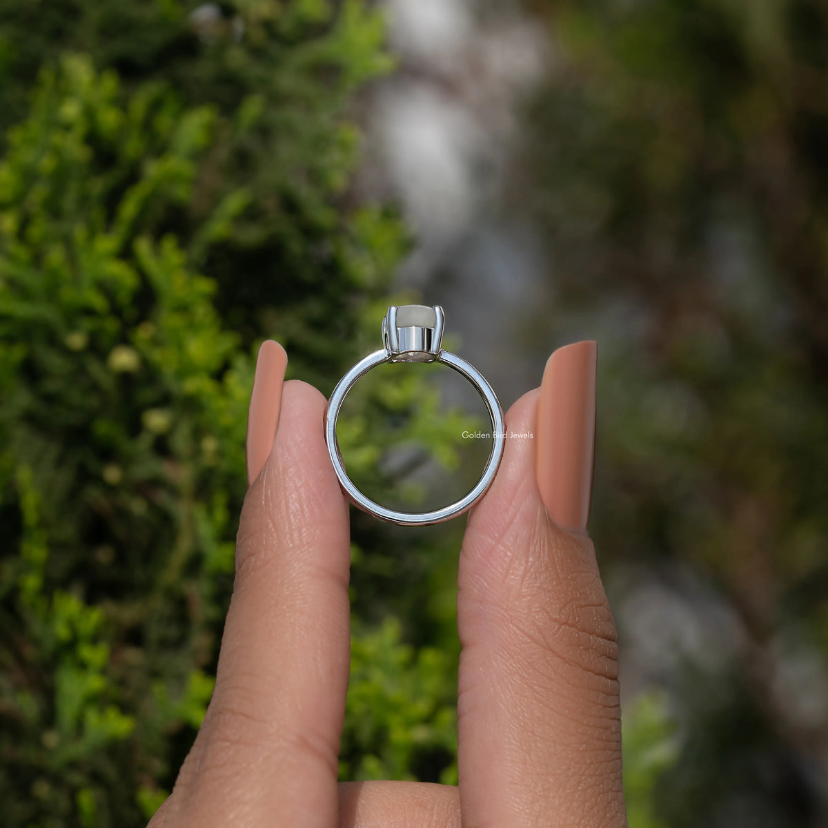 Oval moonstone solitaire ring, 935 Argentium silver, oval stone in four-prong setting top view