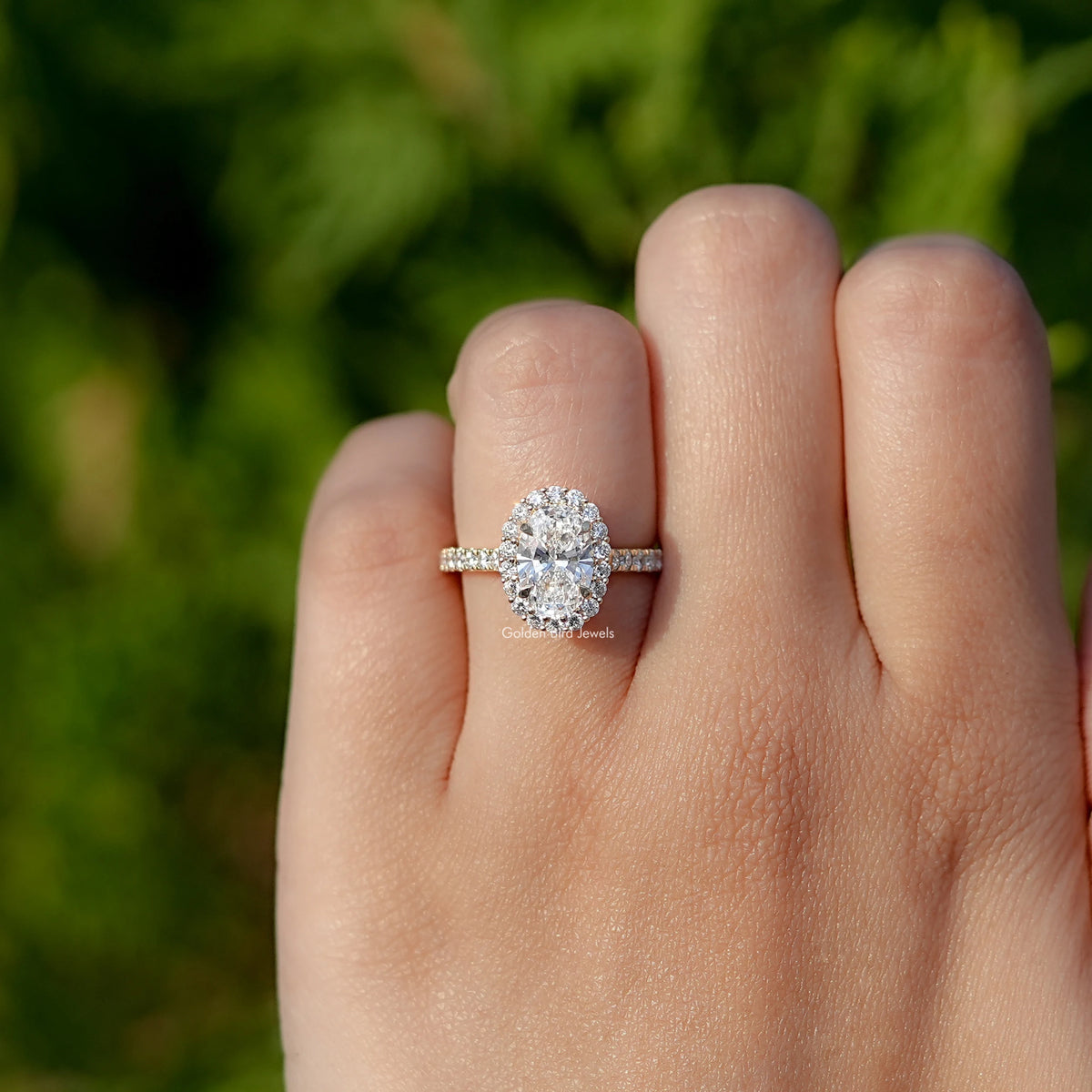 Close-Up View of Oval Cut Lab Diamond Halo Engagement Ring In Yellow Gold 