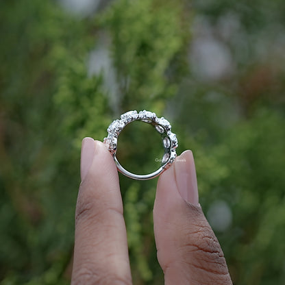 Back view of Oval Cut Diamond Seven Stone Band Held in Finger