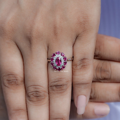 Pink gemstone double halo engagement ring centered on fingers