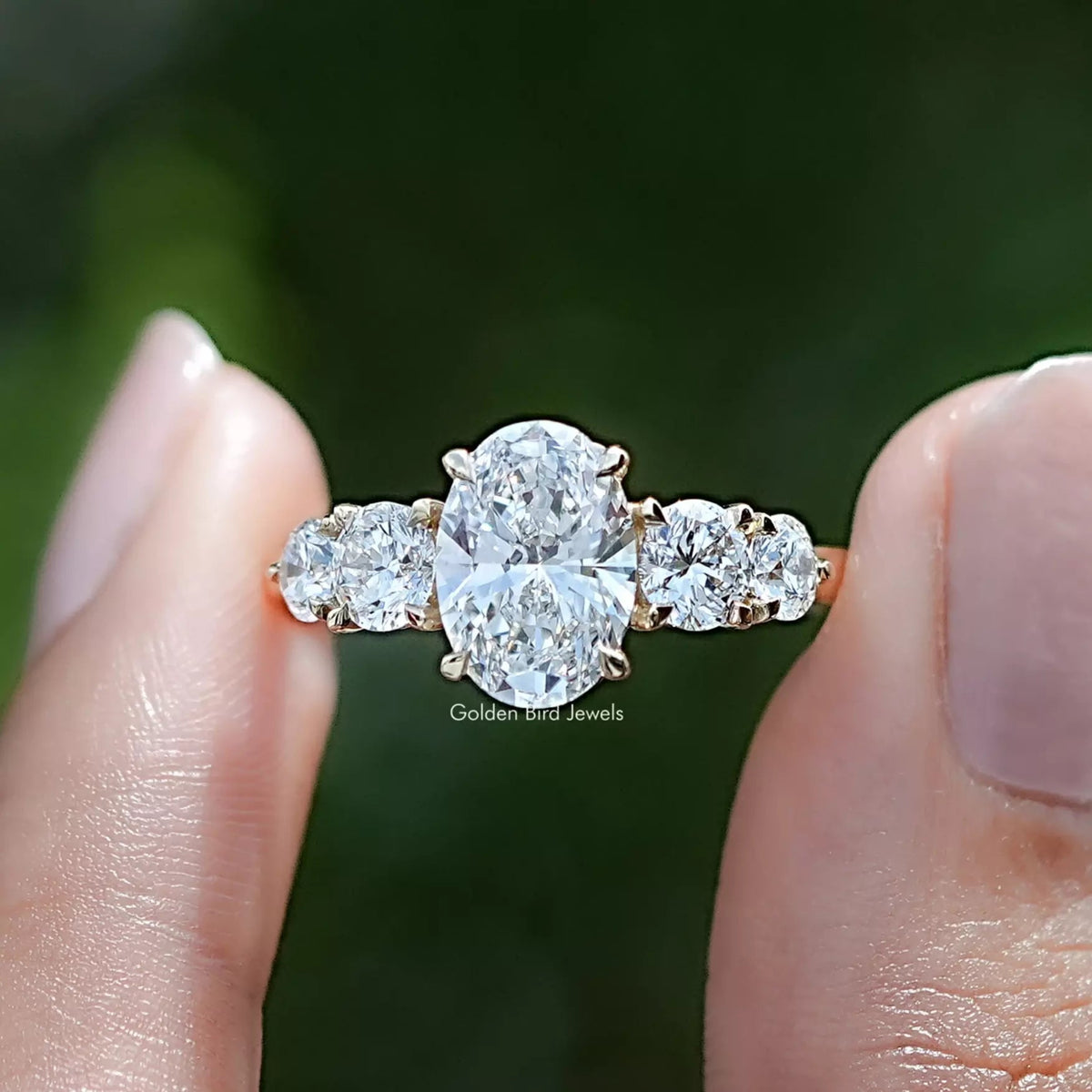 Oval Cut Lab Grown Diamond Five Stone Ring in Two Fingers