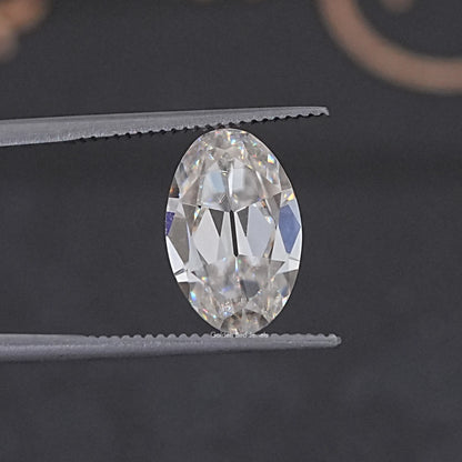 In Tweezer View Of Old Mine Oval Cut Loose Moissanite Stone