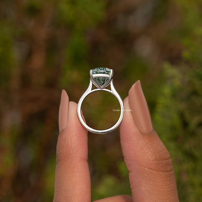 Sterling silver oval moissanite solitaire ring, top view showing prongs over band.
