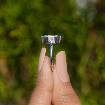 Oval bezel-set moissanite ring in 935 Argentium silver, side view
