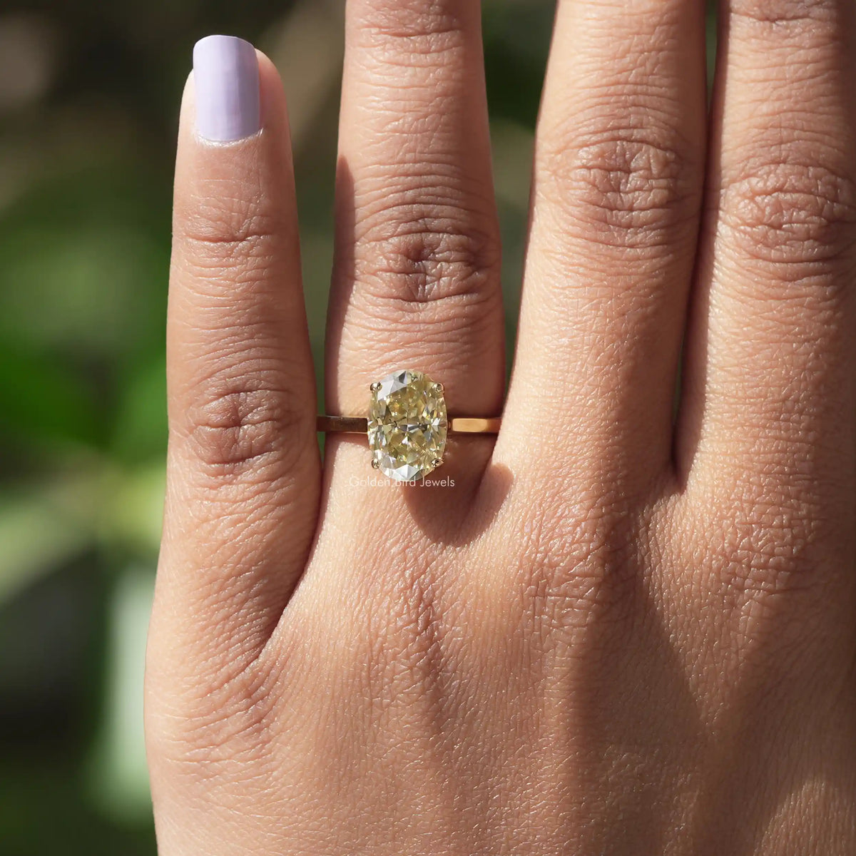 View of Oval Cut Solitaire Engagement Ring In Yellow Gold