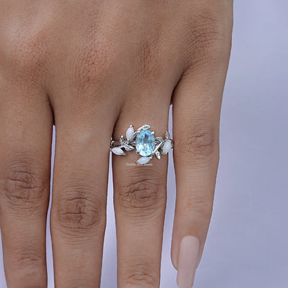 Close-Up View of Oval Cut Gemstone Leaf Style Accent Ring In White Gold