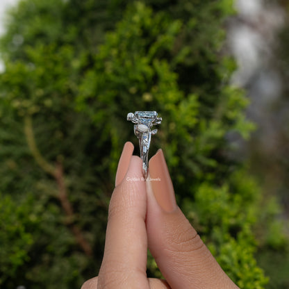 Argentium silver ring profile with oval blue center stone and leaf-like prongs