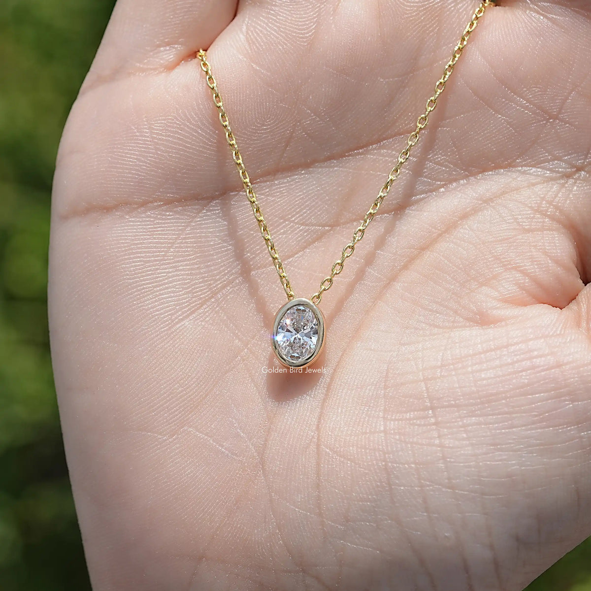 Top View of Oval Cut Bezel Set Solitaire Pendant