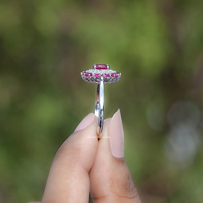 Pink gemstone double halo engagement ring viewed from the side