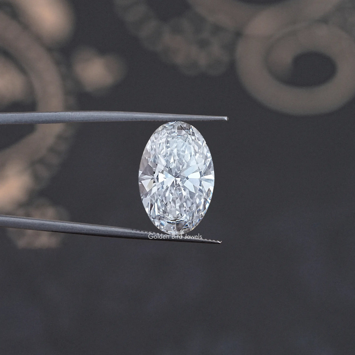 Oval-cut lab diamond on two prongs, close-up view of faceted stone