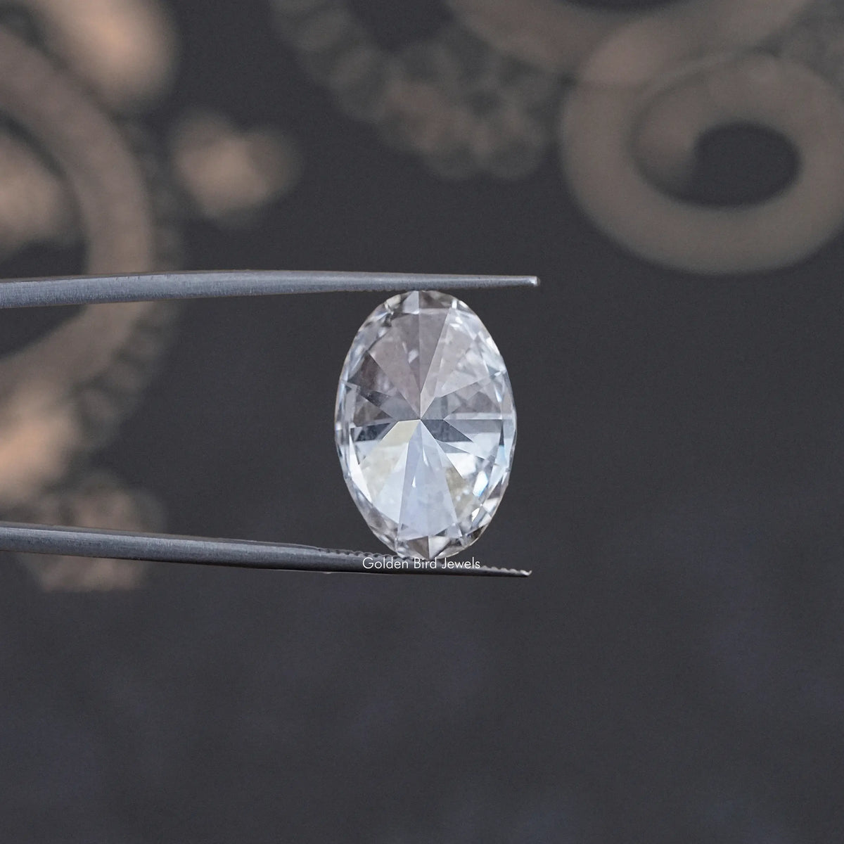 Oval-cut lab diamond on two prongs, angled view highlighting facets