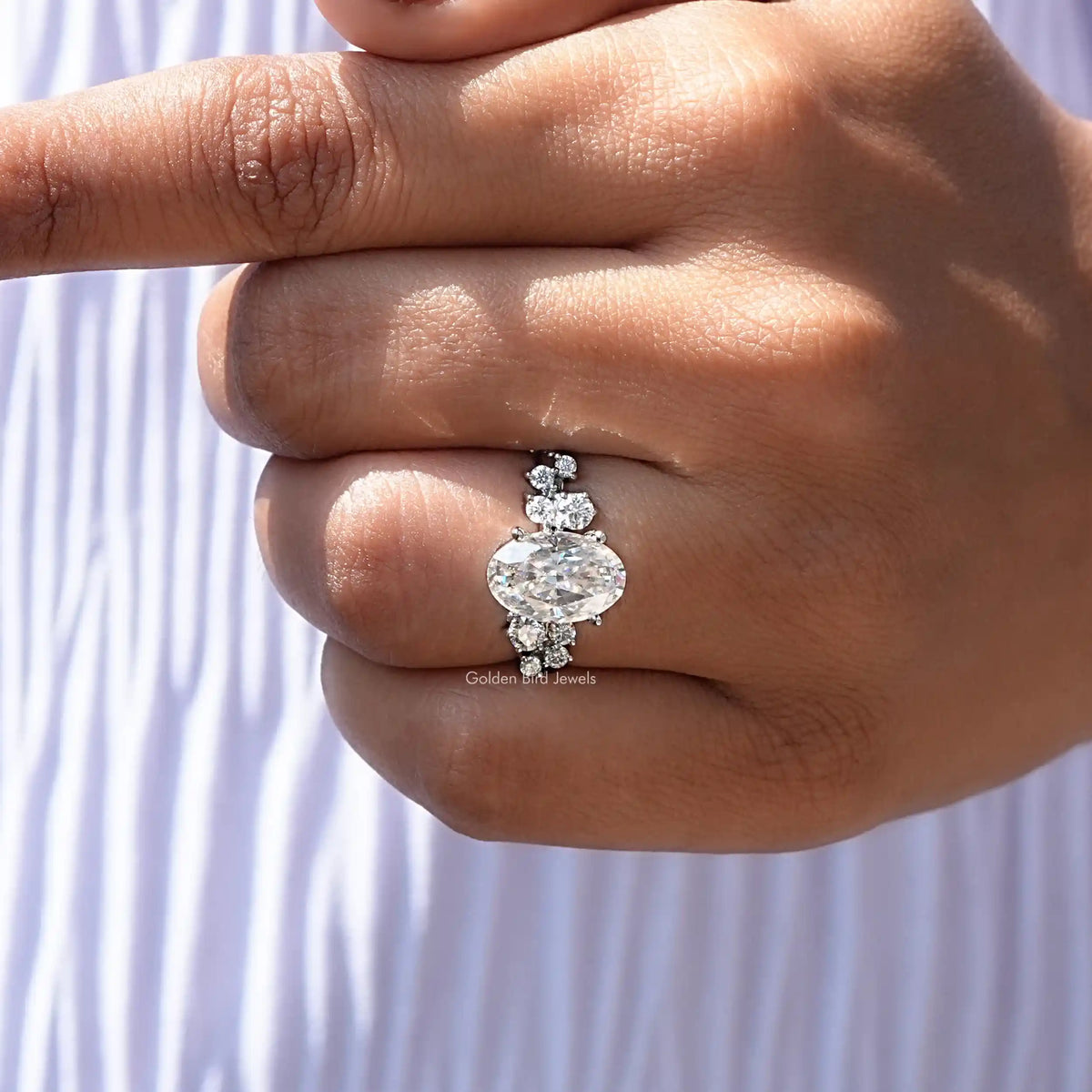 Oval shape halo engagement ring in a colorless moissanite 