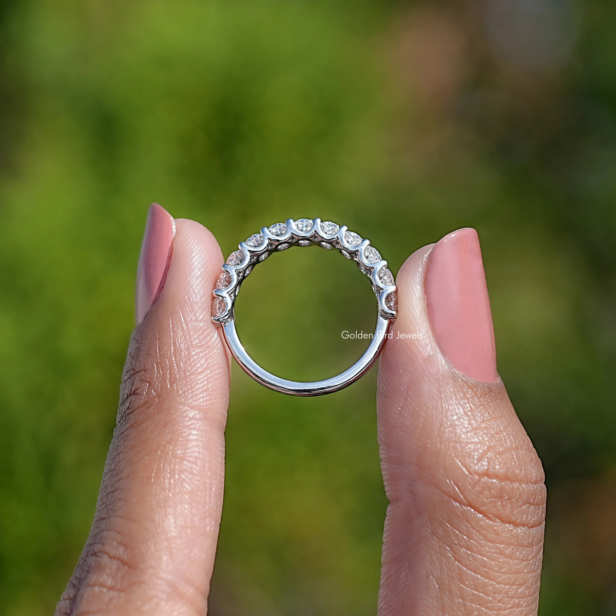 14K white gold oval half eternity band with moissanite stones, curved side view
