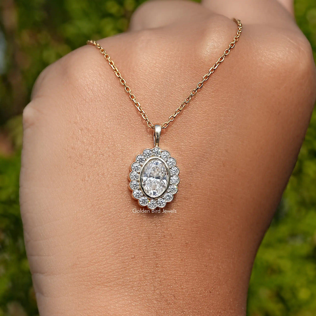 hand Showing View of Oval Cut Moissanite Halo Pendent 
