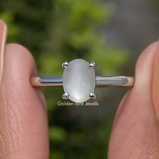 Oval moonstone solitaire ring in 935 Argentium silver, polished band, four-prong setting
