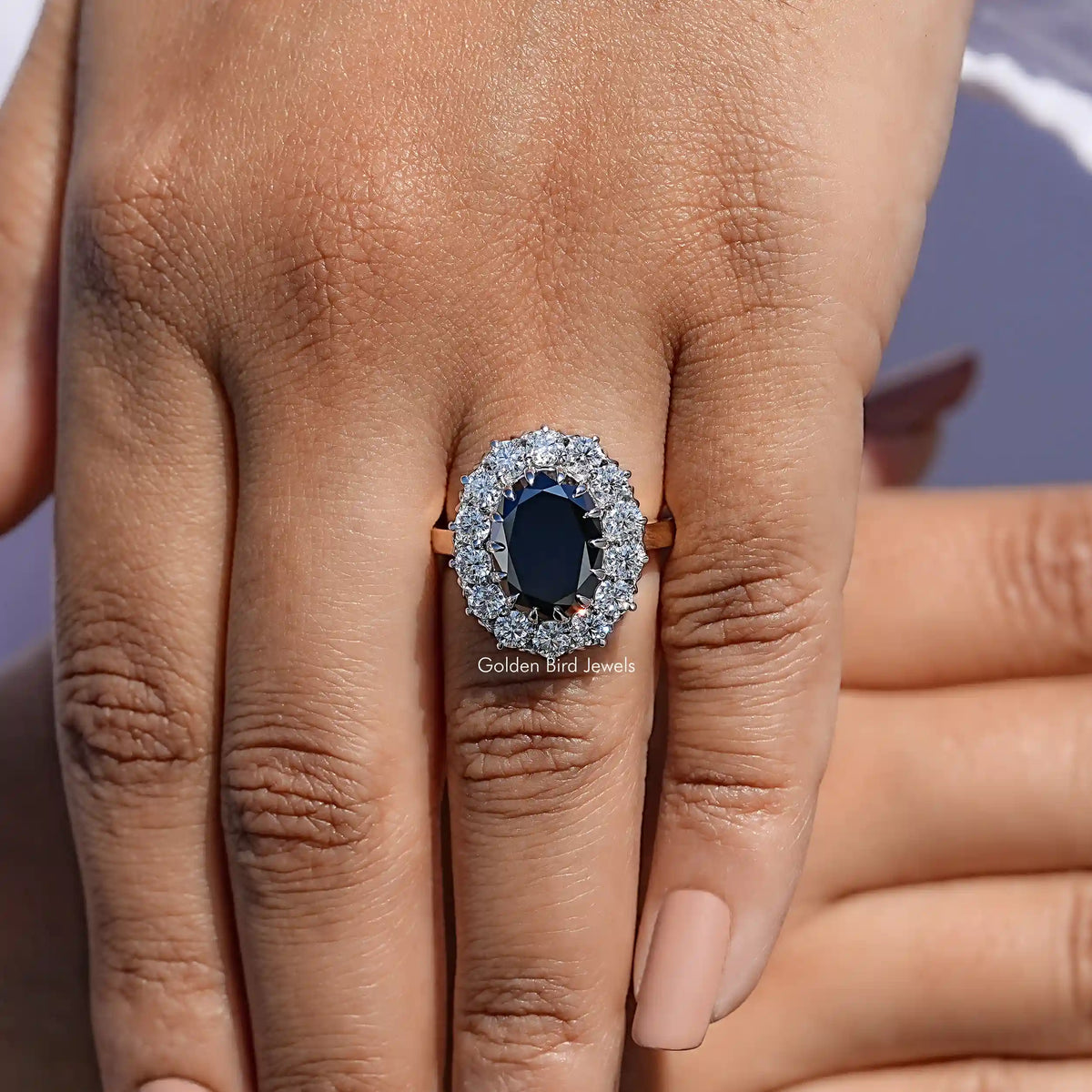 Close View Of Black Oval Cut Halo Engagement Ring

